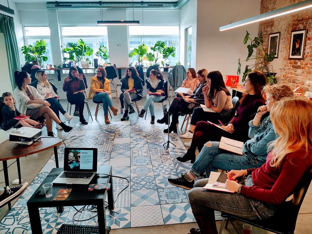 A group of women in a community space classroom.
