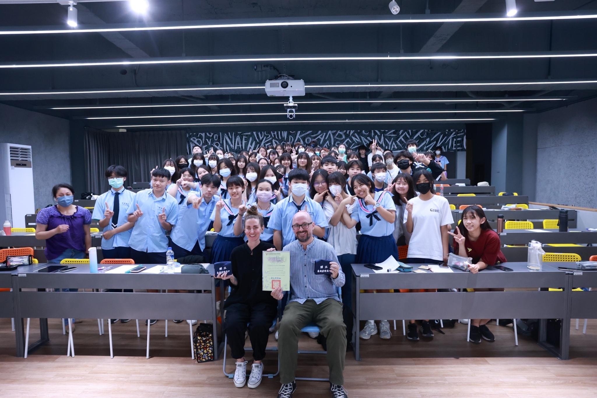 Hannah and Will with students
