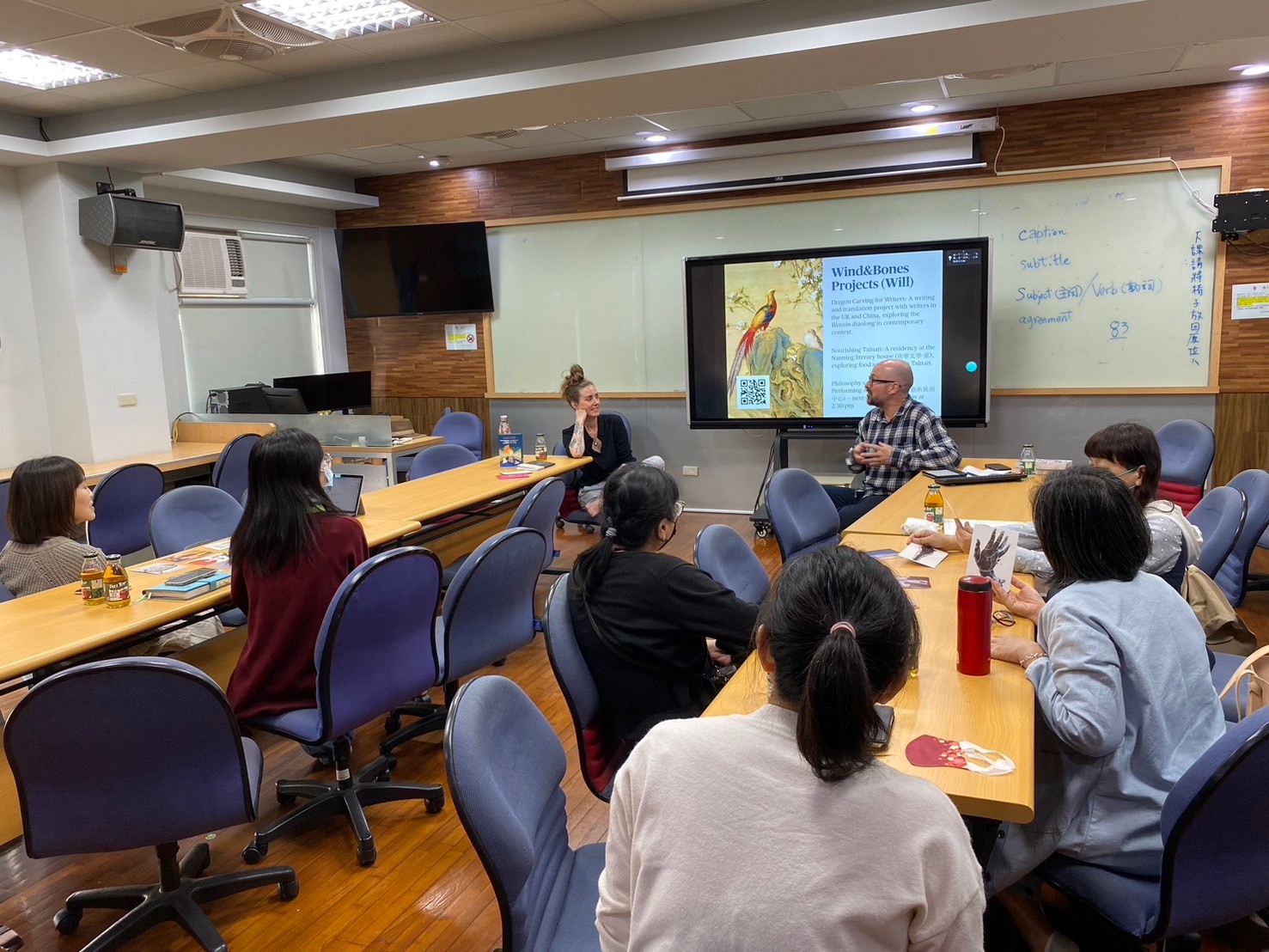Hannah and Will in a classroom with some participants