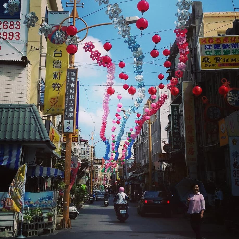 A street view in Taiwan with lanterns lining the road